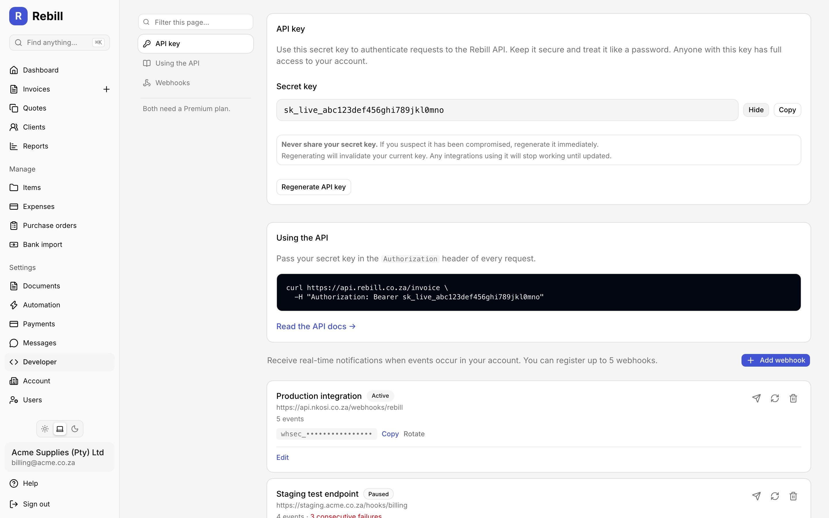 Rebill API key management screen showing a revealed API key with rotate and revoke controls